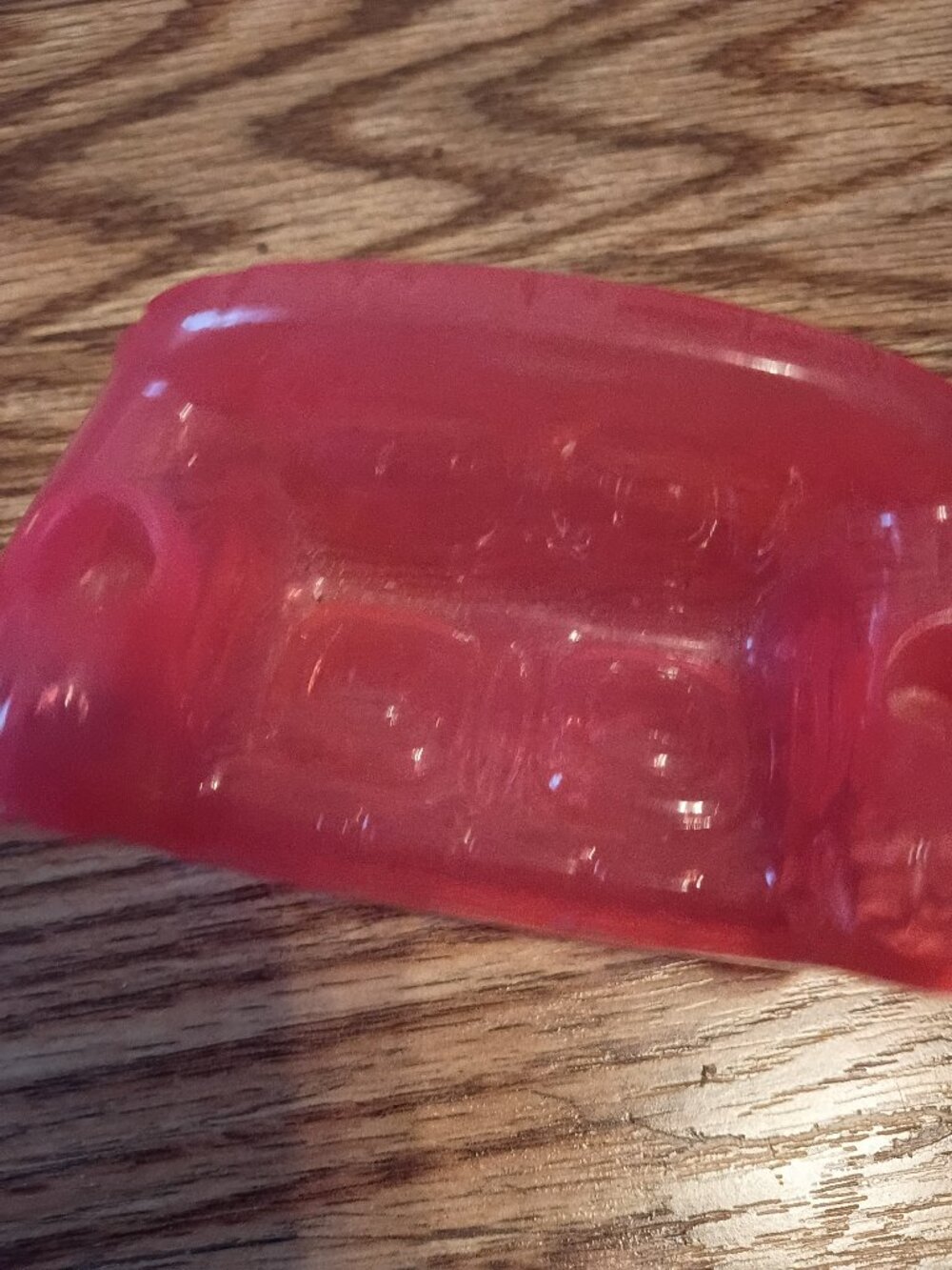 Pink plastic toy dollhouse couch